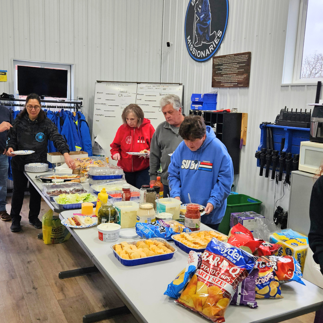 Volunteers having a meal together